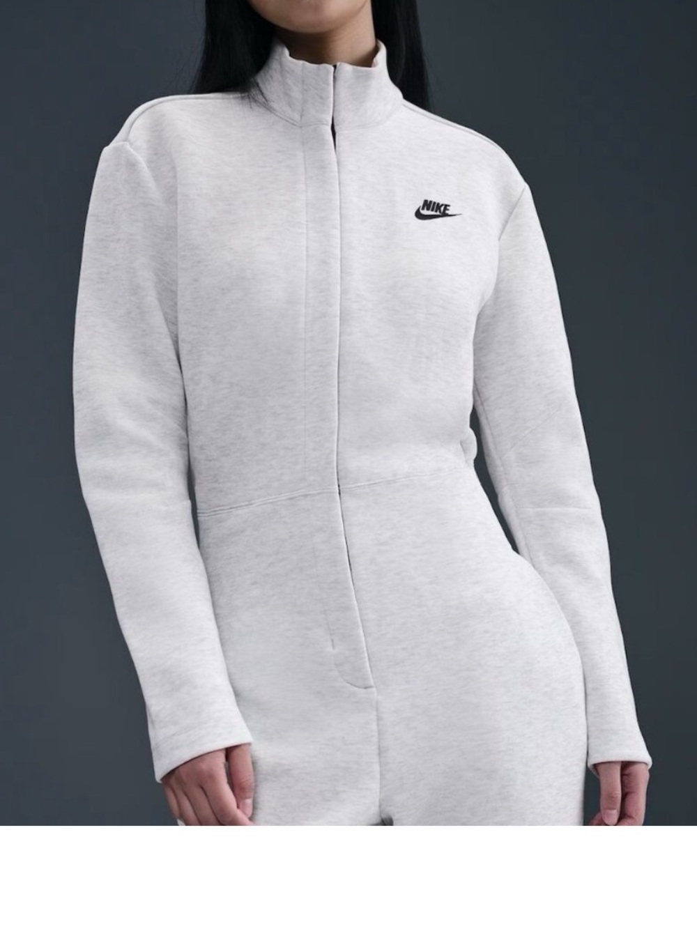Nike Women’s Light Gray Track jumpsuit with Subtle Logo
